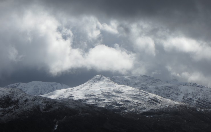 Looking South west to Maol Chean-dearg and Beinn Damph. Spindrift blowing off the ridges during the day.
