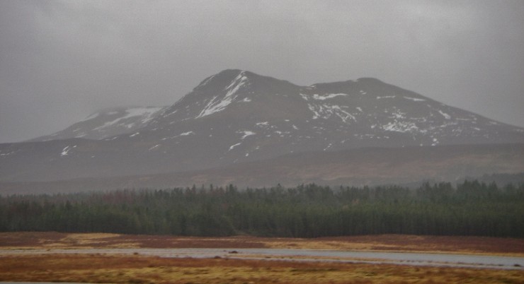 Flooding in Strath Bran and little snow left on Sgurr a' Choire-rainich.