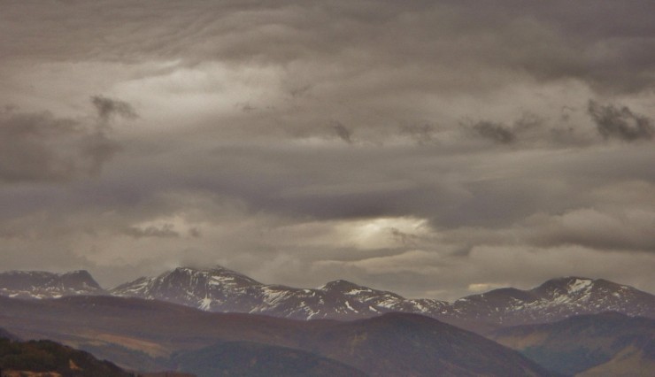 The Beinn Dearg mountains with an ominous cloudscape and diminishing snowpack.