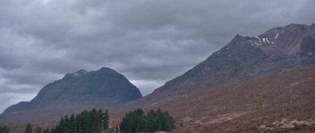 A gloomy, almost snowless Liathach and Coire an Laoigh, Beinn Eighe right.