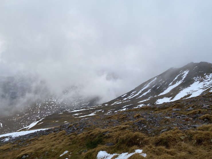 Beinn Eighe ridge on right, with Liathach in the murk in the distance.