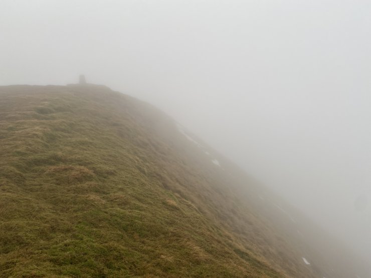 Fionn Bhienn summit. Almost no snow on this high NE aspect to the right.