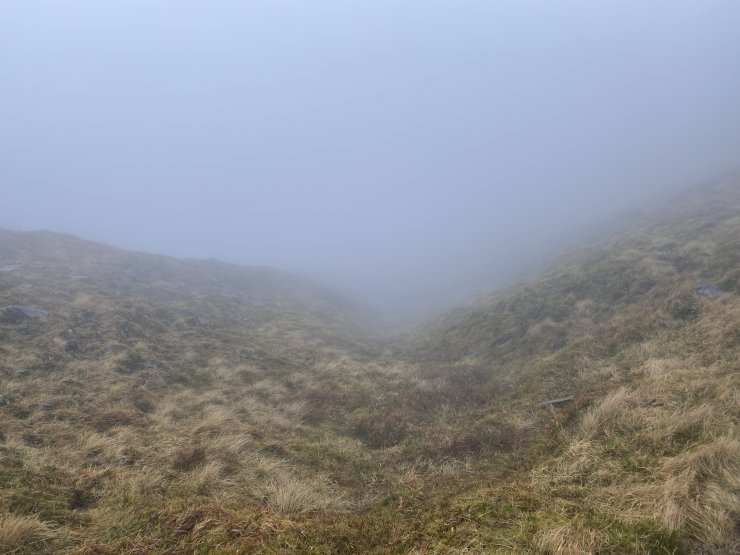 Looking down a classic snow trap. A steep re-entrant feature with a South-East aspect at 760 metres. No evidence here.