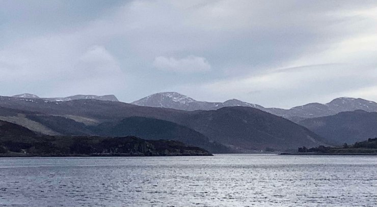 Beinn Dearg from across Loch Broom showing significant snow loss.