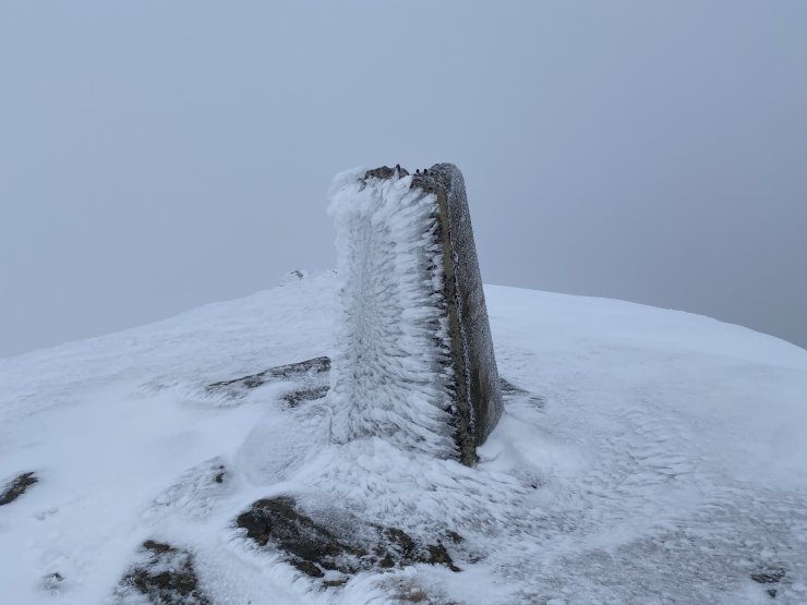 Fionn Bheinn trig point well rimed.