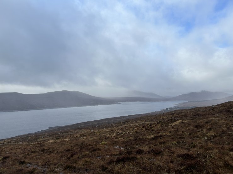 Looking across Loch Fannich to a murky Fionn Bheinn hidden in cloud.